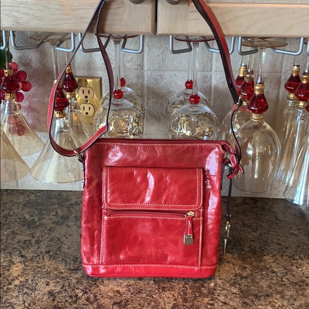 Lovely soft red genuine leather cross body purse.